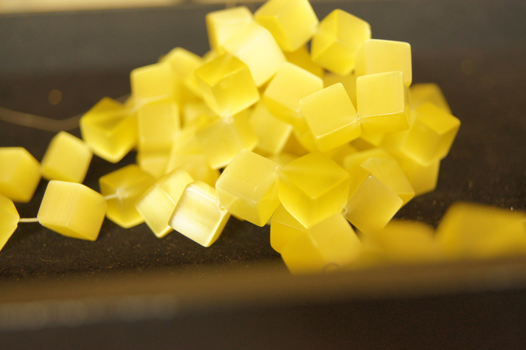 Bead, fire-polished, deep gloss golden orange, 10mm cube - $0.50 per 3pc