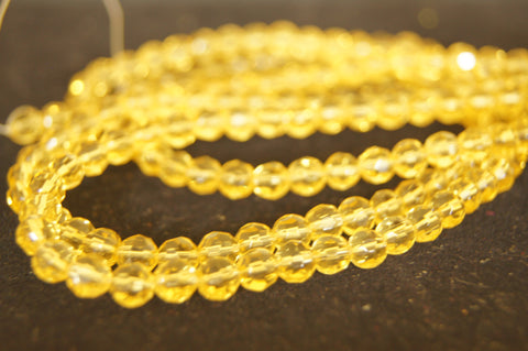 Bead, fire-polished glass, clear yellow, 4mm faceted round - $0.50 per 3pc