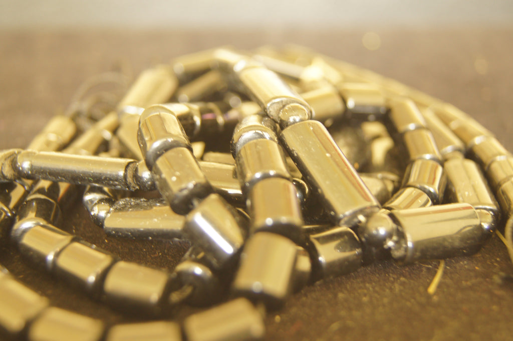 Bead, fire-polished, jet, glossy black, 50mmx10mm  tube $0.50 per 3pc