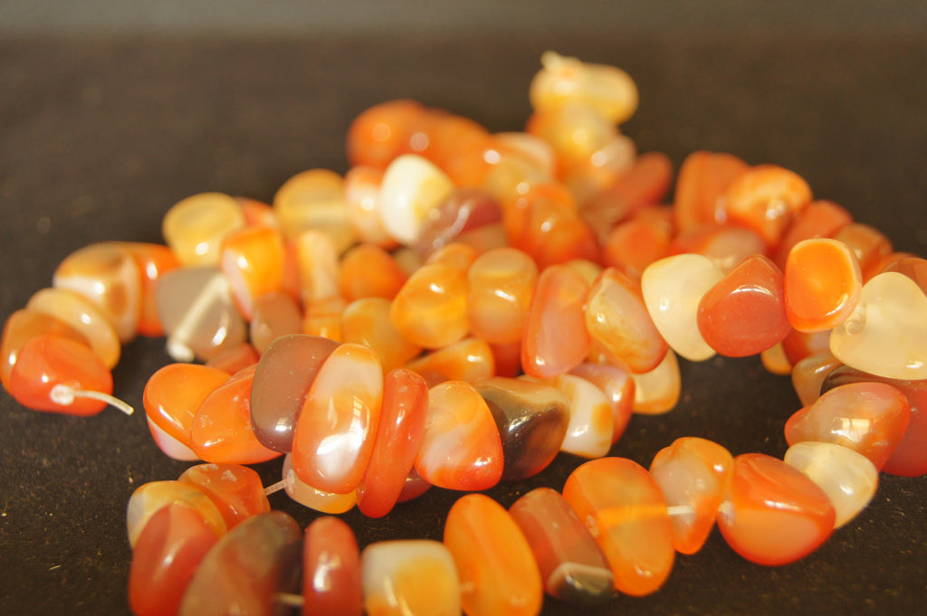 Bead, sunstone (natural),  round, C grade, Mohs hardness 6 - 12, 96pc, hand-cut 1cm x 1cm - $0.50 per pc