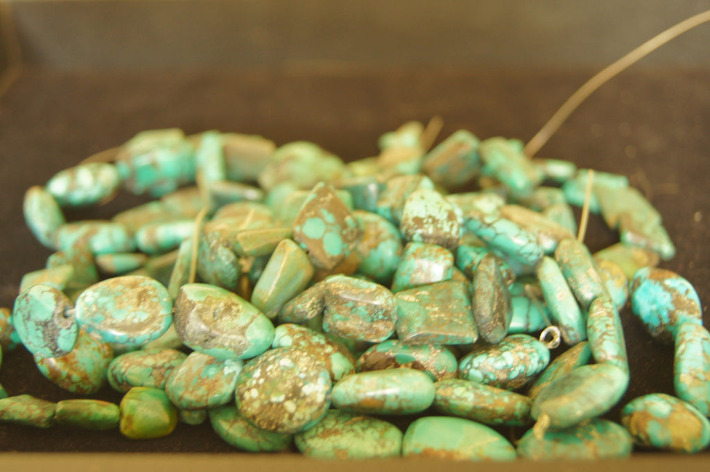 Bead, turquoise (dyed  stabilized), blue-green, small pebble, Mohs hardness 5 to 6. Ave size 1cm x 1cm - $0.50 per pc