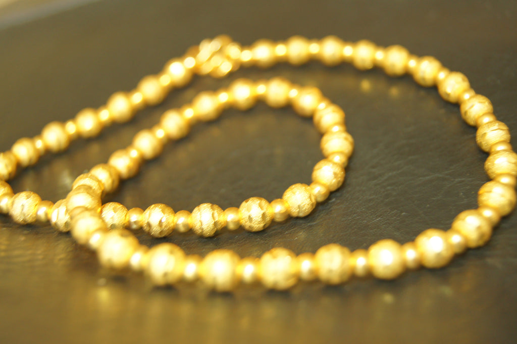 Chain, gold finished steel, 5x3mm textured ball cable-$1.35 per 10cm
